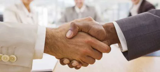 Business representatives shaking hands